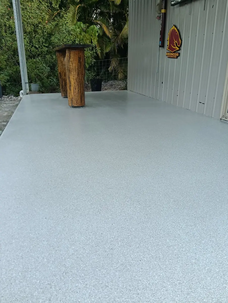 The same alfresco slab finished in a pale grey epoxy flake coating